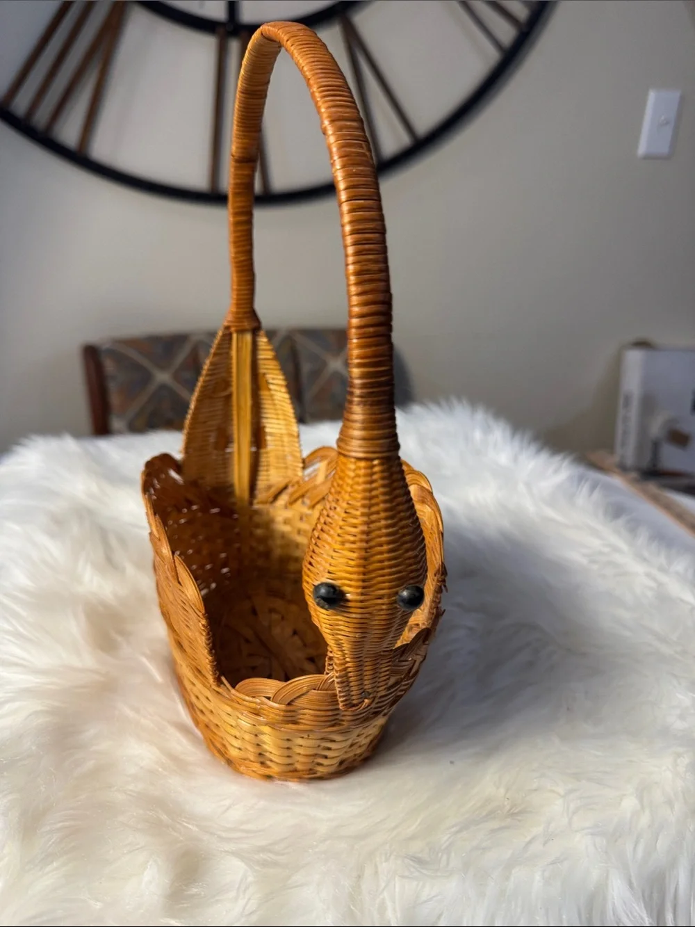 This vintage handwoven wicker and rattan swan-shaped basket.